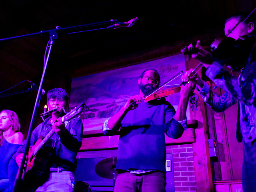 Students and members of the band Darlingside perform at The Log in January 2025